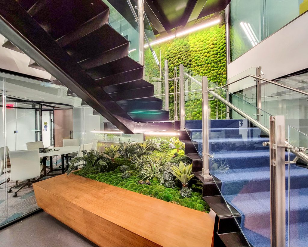 preserved moss wall with artificial plants