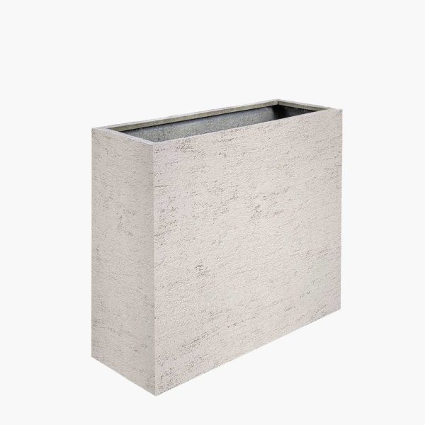 The Riven - Tall planter with artisanal texture and natural finish from the Oterra family, designed for modern commercial interiors and exteriors.