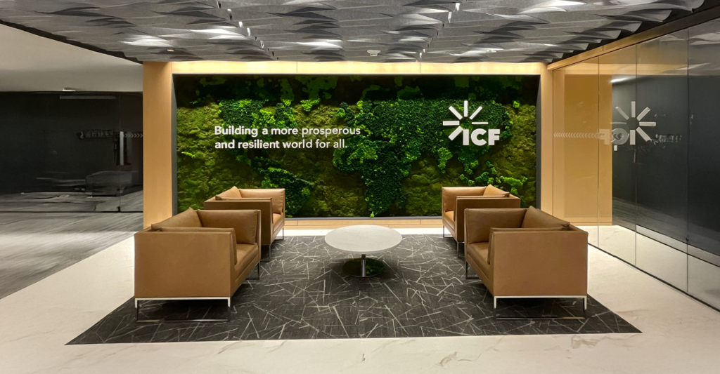 Custom 20-foot preserved moss world map installation at ICF International Reston office by Green Oasis.