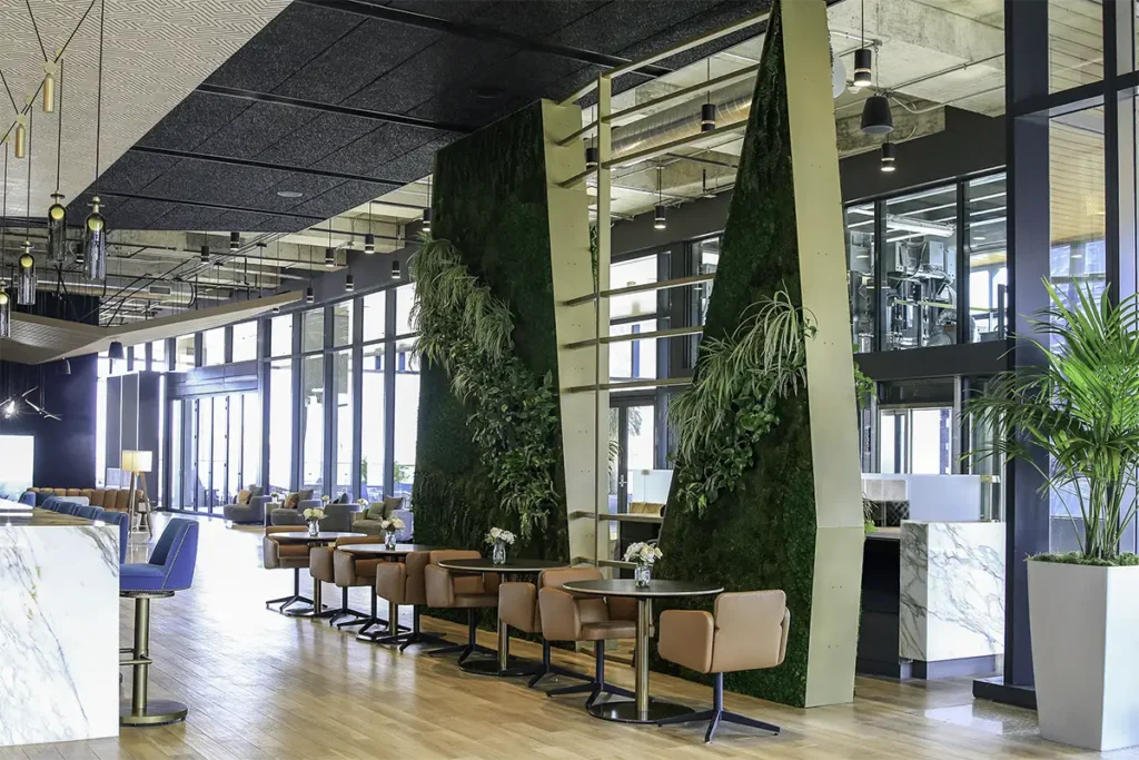 Hybrid moss and living wall installation at 405 Colorado in Austin by Green Oasis, combining preserved moss and live plants.