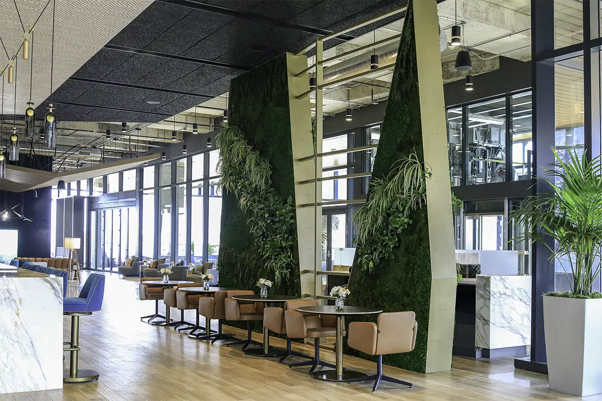 Hybrid moss and living wall installation at 405 Colorado in Austin by Green Oasis, combining preserved moss and live plants.