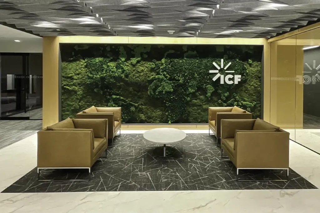 Custom 20-foot preserved moss world map installation at ICF International Reston office by Green Oasis.
